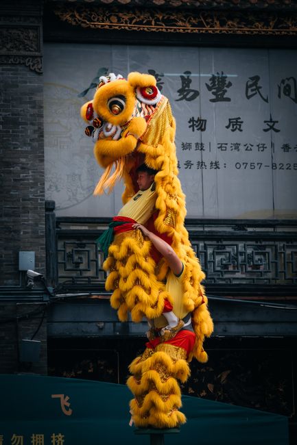 Colorful lion dance in a Chinatown, showcasing traditional Chinese culture and celebrations, Huizhou, Guangdong