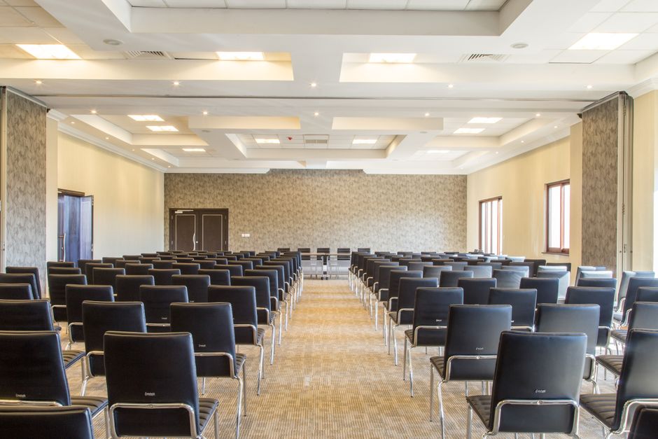 Spacious empty conference room with modern design and neatly arranged black chairs, Huizhou, Guangdong