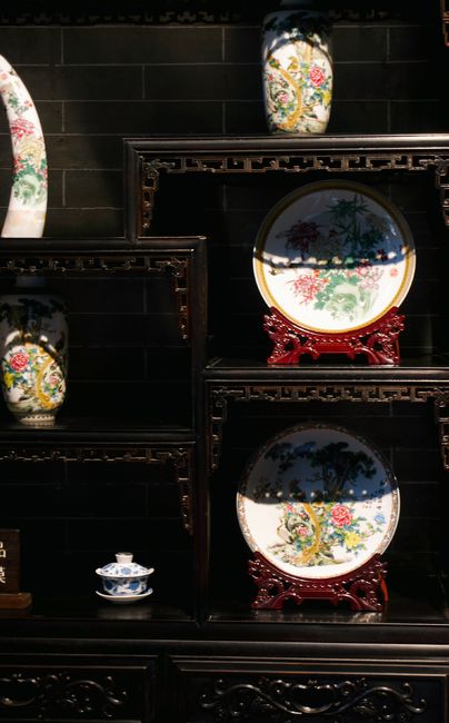 Elegant shelves with intricate Chinese porcelain plates and vases on display, Huizhou, Guangdong