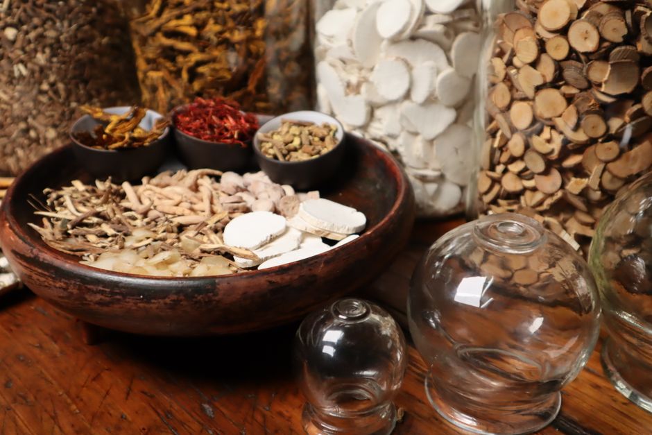 Close-up of herbal ingredients and glass jars used in traditional Chinese medicine therapy, Huizhou, Guangdong