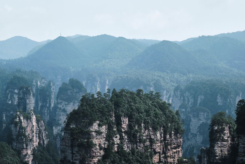 Stunning view of Zhangjiajie's iconic sandstone pillars and lush mountains, Huizhou, Guangdong