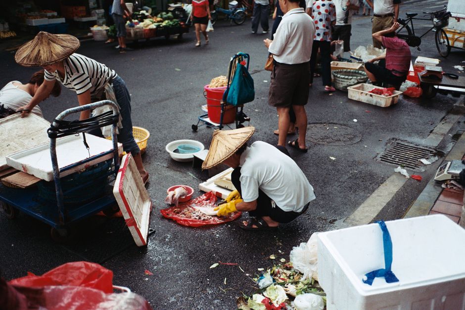 Vibrant street market in Xiamen, China, showcasing local vendors and fresh produce. — Huizhou, Guangdong, China