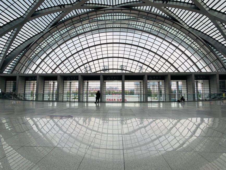 A captivating view of the modern interior of Tianjin West Railway Station, highlighting its architectural design. —