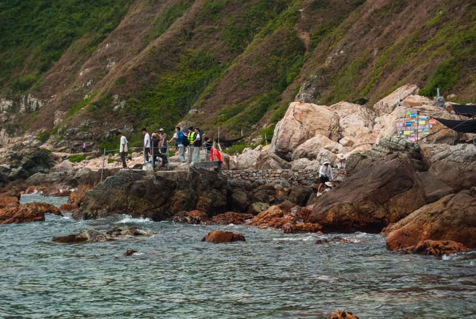 Discover a serene cobblestone path amidst lush green forest leading to majestic mountains under a vi — Huizhou, Guangdong, China